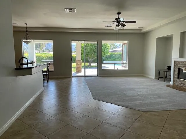 a view of a livingroom with furniture and a window