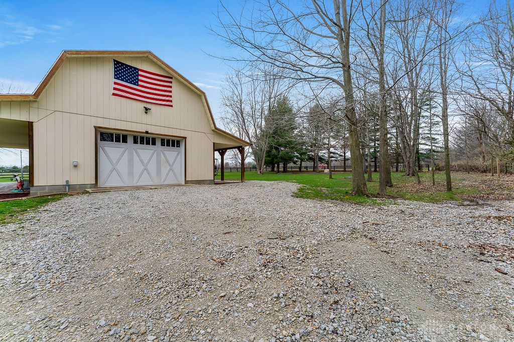 7400 Cook-Jones Road Waynesville, OH 45068 - Photo 58 of 72 This charming barn offers ample space and a classic aesthetic amidst a peaceful, tree-lined setting.