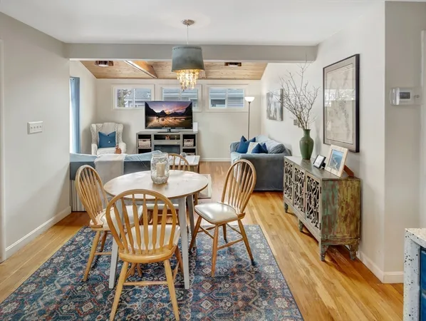 a dining room with furniture and chandelier