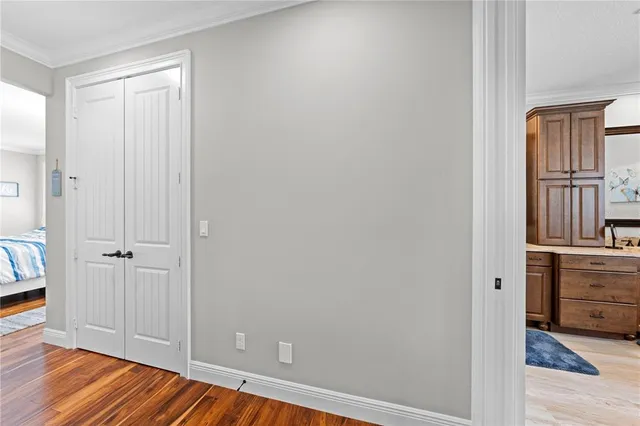 a bedroom with bed and a chandelier