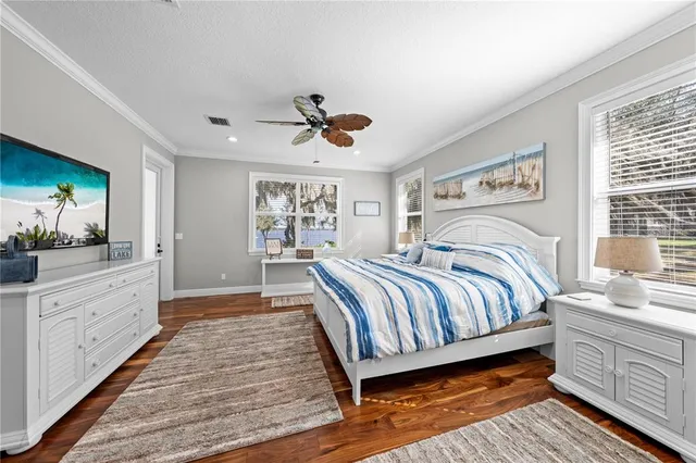 a bedroom with a large bed and a window