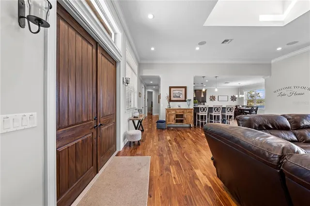 a large kitchen with a table and chairs