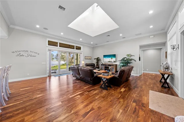a kitchen with kitchen island granite countertop a sink stove and refrigerator