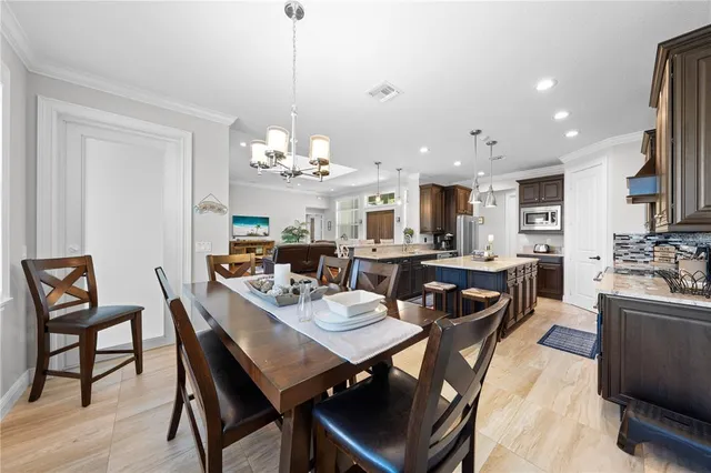 a utility room with cabinets washer and dryer