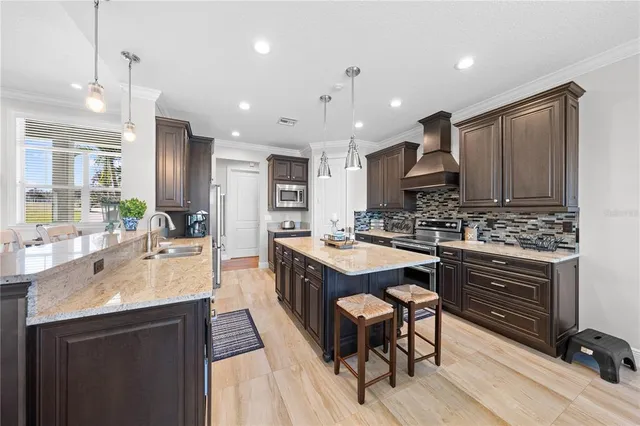 a view of a room with wooden floor and a window