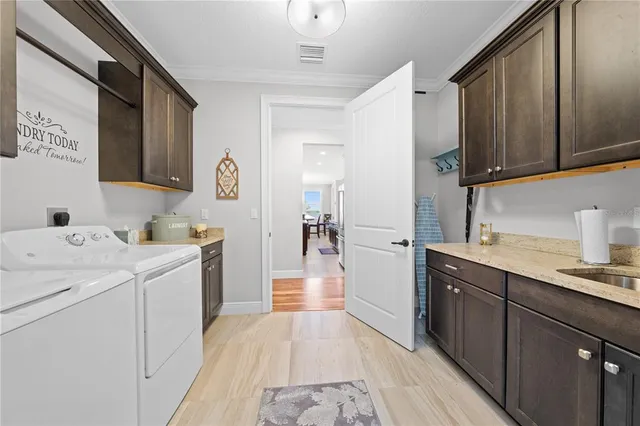 a view of a house with swimming pool and a yard