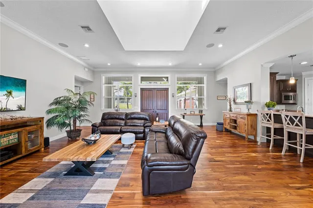 a view of a chairs and table in patio with a backyard
