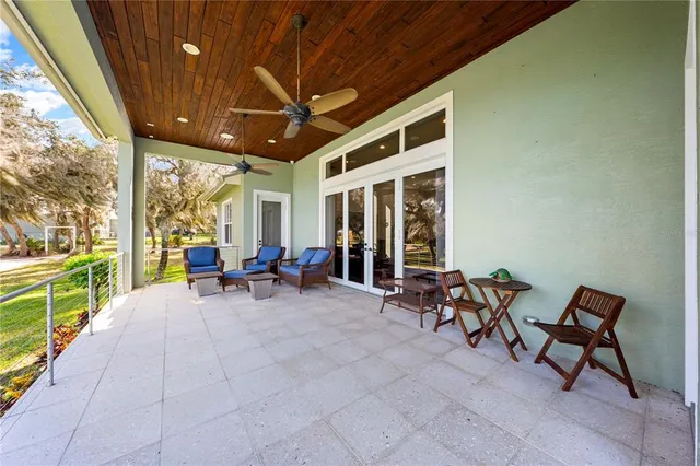 a view of a hallway with white walls and stairs