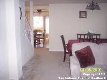 a balcony with table and chairs