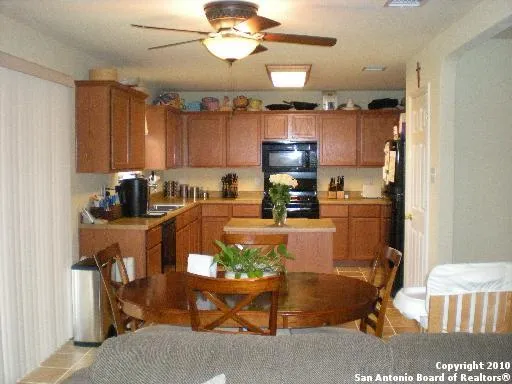 a kitchen with a refrigerator and a sink