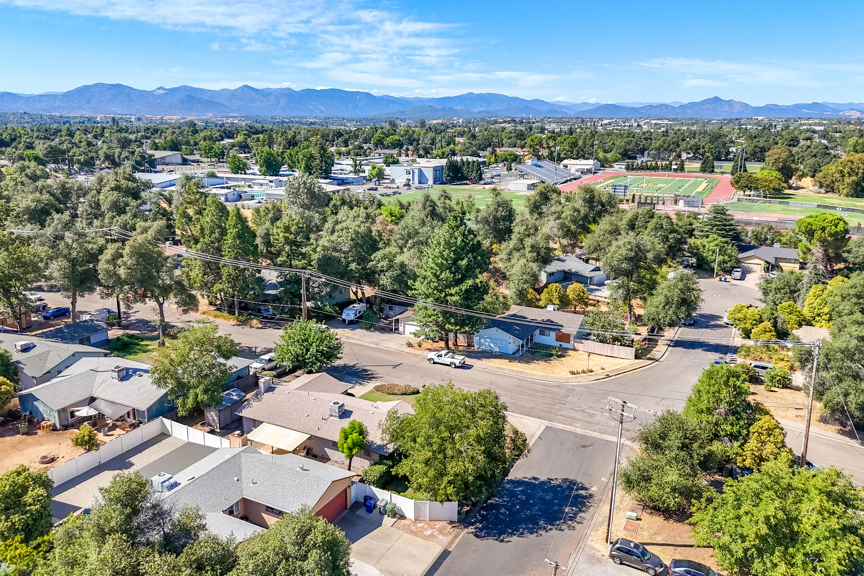 1201 Echo Road Redding, CA 96002 - Photo 54 of 54 an aerial view of a city with lots of residential buildings ocean and mountain view in back