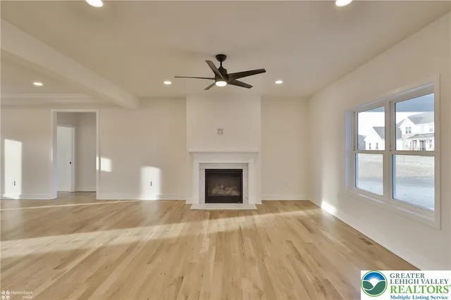 a kitchen with appliances a refrigerator and cabinets