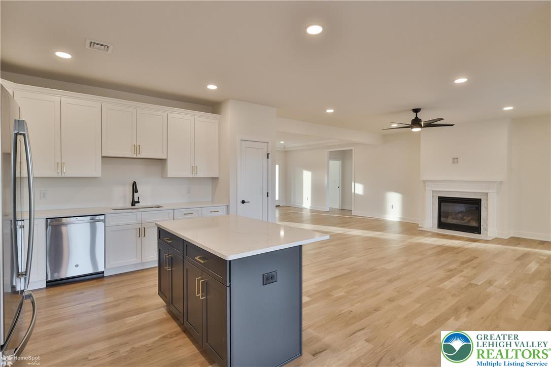 448 Long Lane Road Walnutport, PA 18088 - Photo 24 of 65 a large kitchen with stainless steel appliances a sink and cabinets