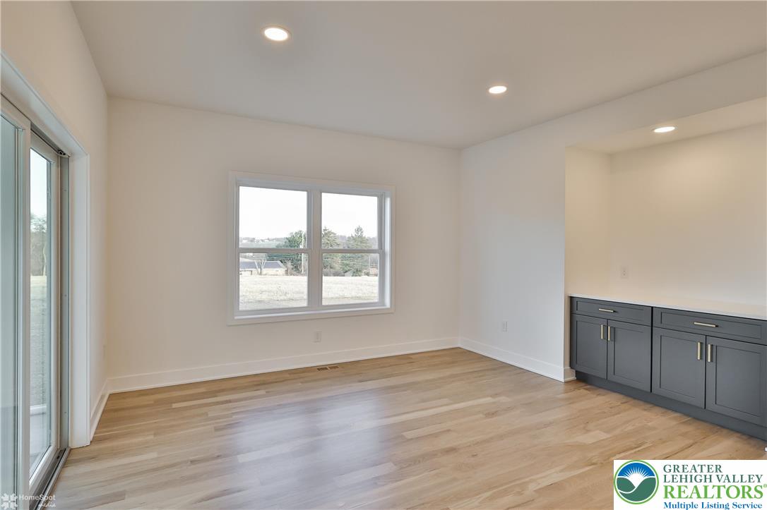 448 Long Lane Road Walnutport, PA 18088 - Photo 27 of 65 an empty room with wooden floor and windows