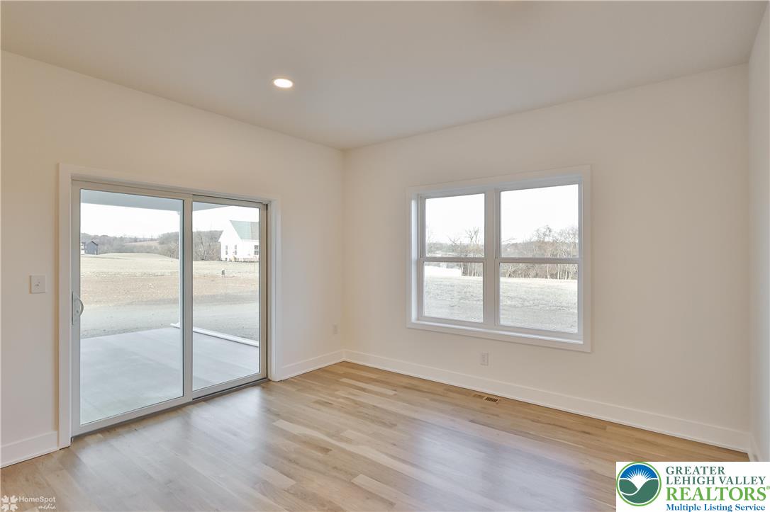 448 Long Lane Road Walnutport, PA 18088 - Photo 29 of 65 an empty room with wooden floor and windows