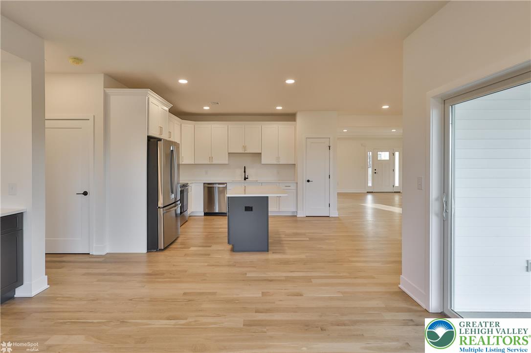 448 Long Lane Road Walnutport, PA 18088 - Photo 31 of 65 a kitchen with stainless steel appliances kitchen island granite countertop a refrigerator and a stove top oven