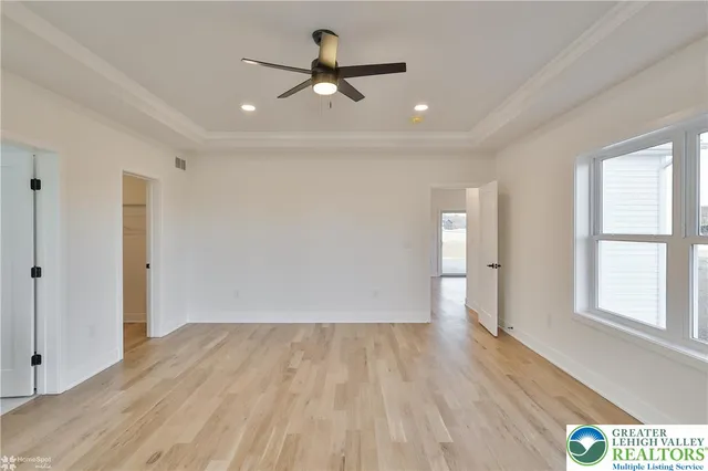 a view of room with wooden floor
