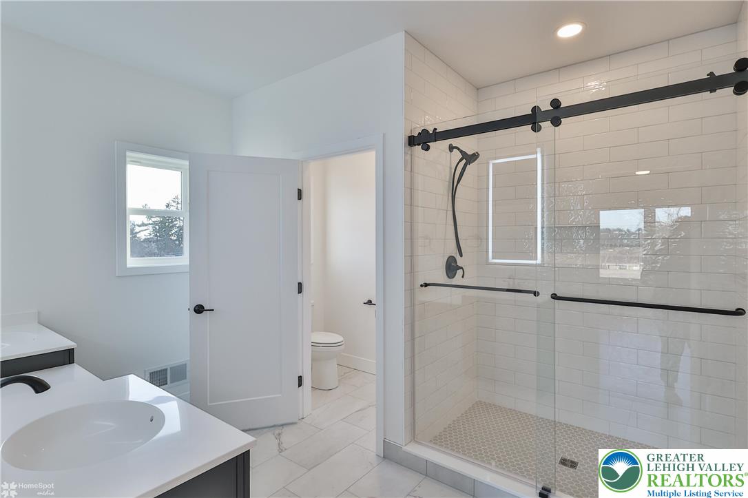 448 Long Lane Road Walnutport, PA 18088 - Photo 42 of 65 a bathroom with a sink toilet and shower