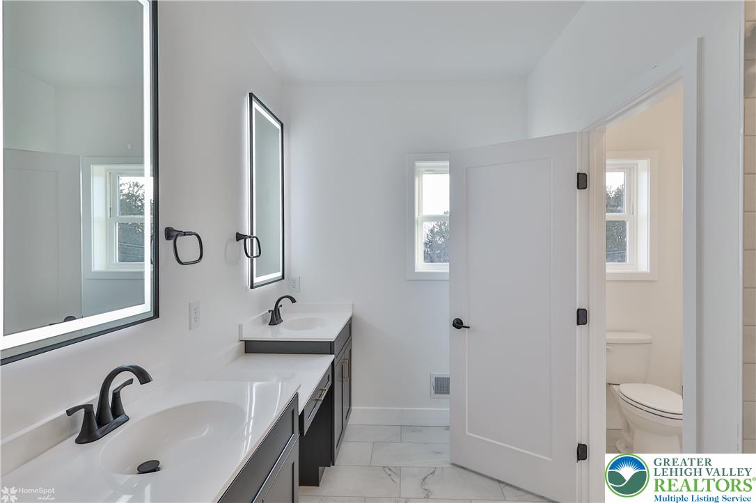448 Long Lane Road Walnutport, PA 18088 - Photo 43 of 65 a bathroom with a double vanity sink mirror and