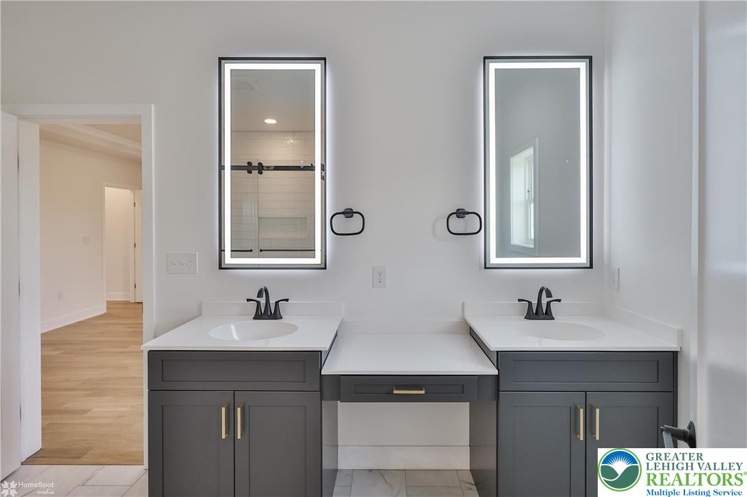 448 Long Lane Road Walnutport, PA 18088 - Photo 44 of 65 a bathroom with a sink and a mirror