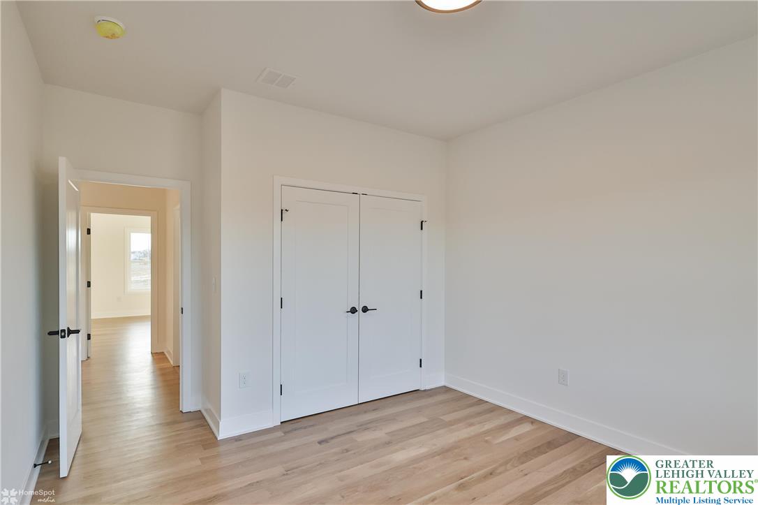 448 Long Lane Road Walnutport, PA 18088 - Photo 46 of 65 a view of an empty room with wooden floor