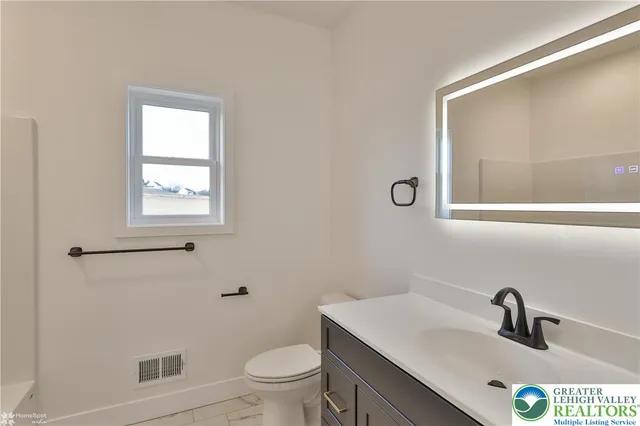 a view of a house with a yard and garage