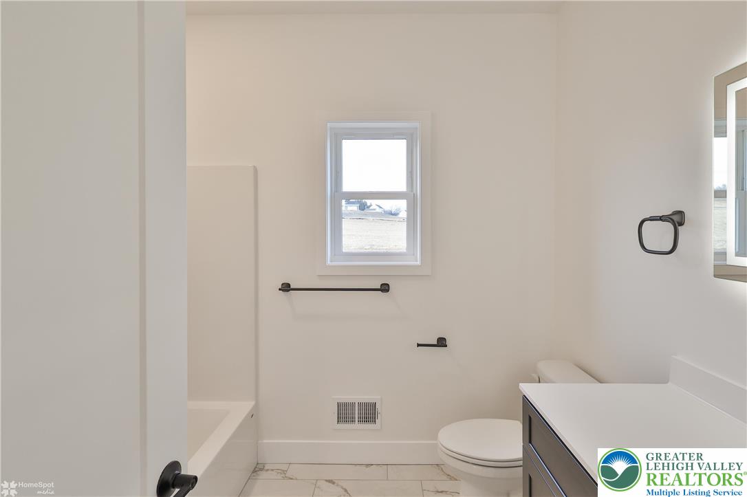 448 Long Lane Road Walnutport, PA 18088 - Photo 49 of 65 a bathroom with a toilet and a shower