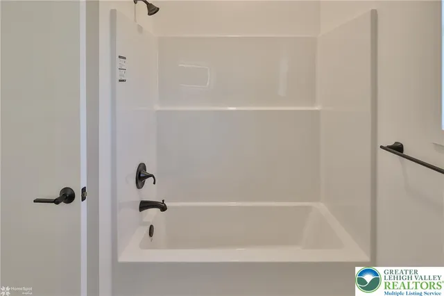 a view of a houses with a road