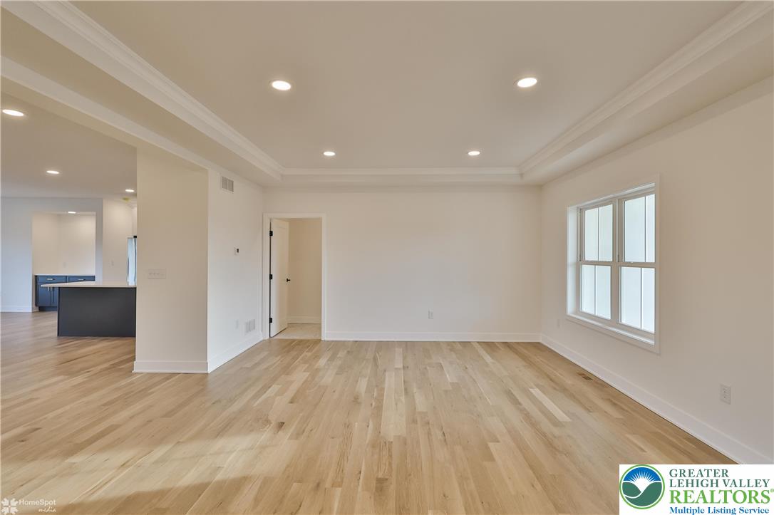448 Long Lane Road Walnutport, PA 18088 - Photo 6 of 65 a view of empty room with wooden floor and fan