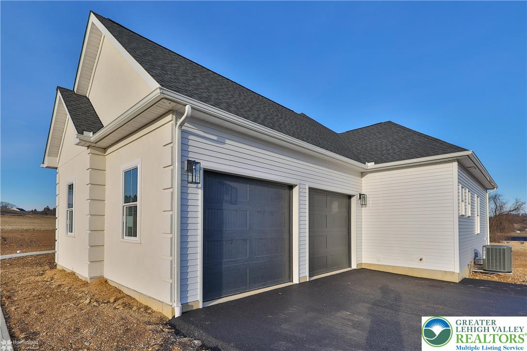 448 Long Lane Road Walnutport, PA 18088 - Photo 61 of 65 a front view of a house with a garage