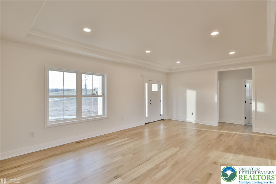 448 Long Lane Road Walnutport, PA 18088 - Photo 8 of 65 a view of an empty room with wooden floor and a window