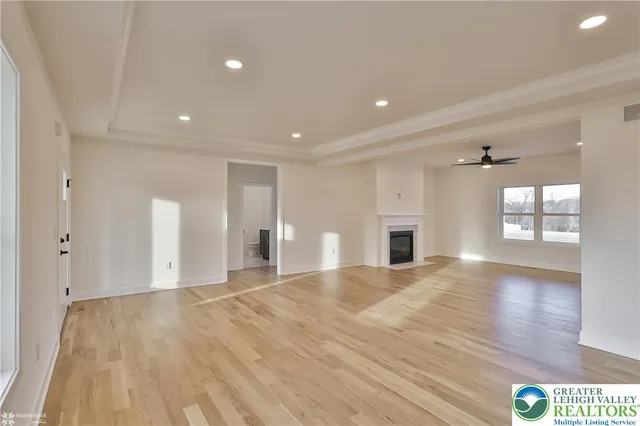a view of kitchen with kitchen island a sink and a stove