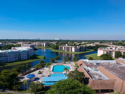 an aerial view of a house with a lake view