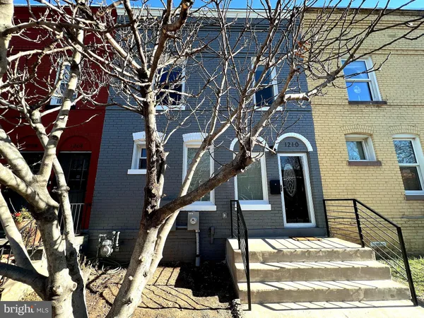a view of a house with a tree