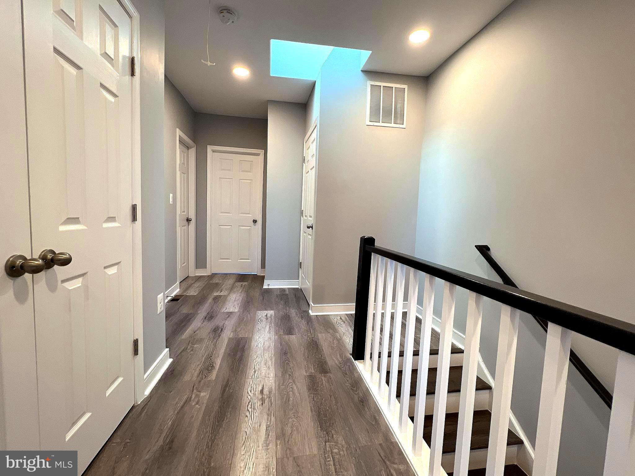 1210 Half Street Southwest Washington, DC 20024 - Photo 19 of 40 a view of a hallway with wooden floor and staircase