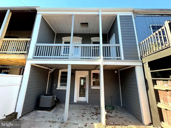 a front view of a house with a balcony