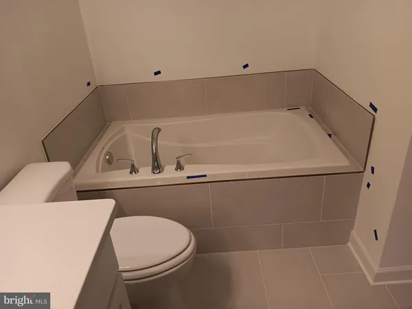 a bathroom with a toilet and a sink
