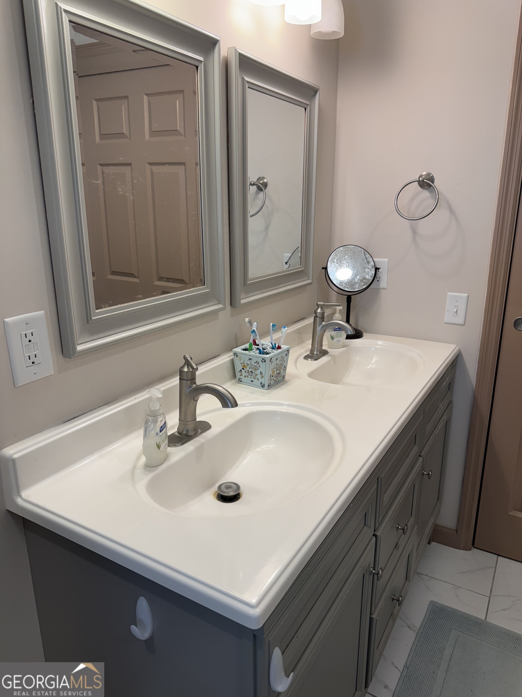404 Ready Street St. Marys, GA 31558 - Photo 11 of 14 a bathroom with a sink and a mirror
