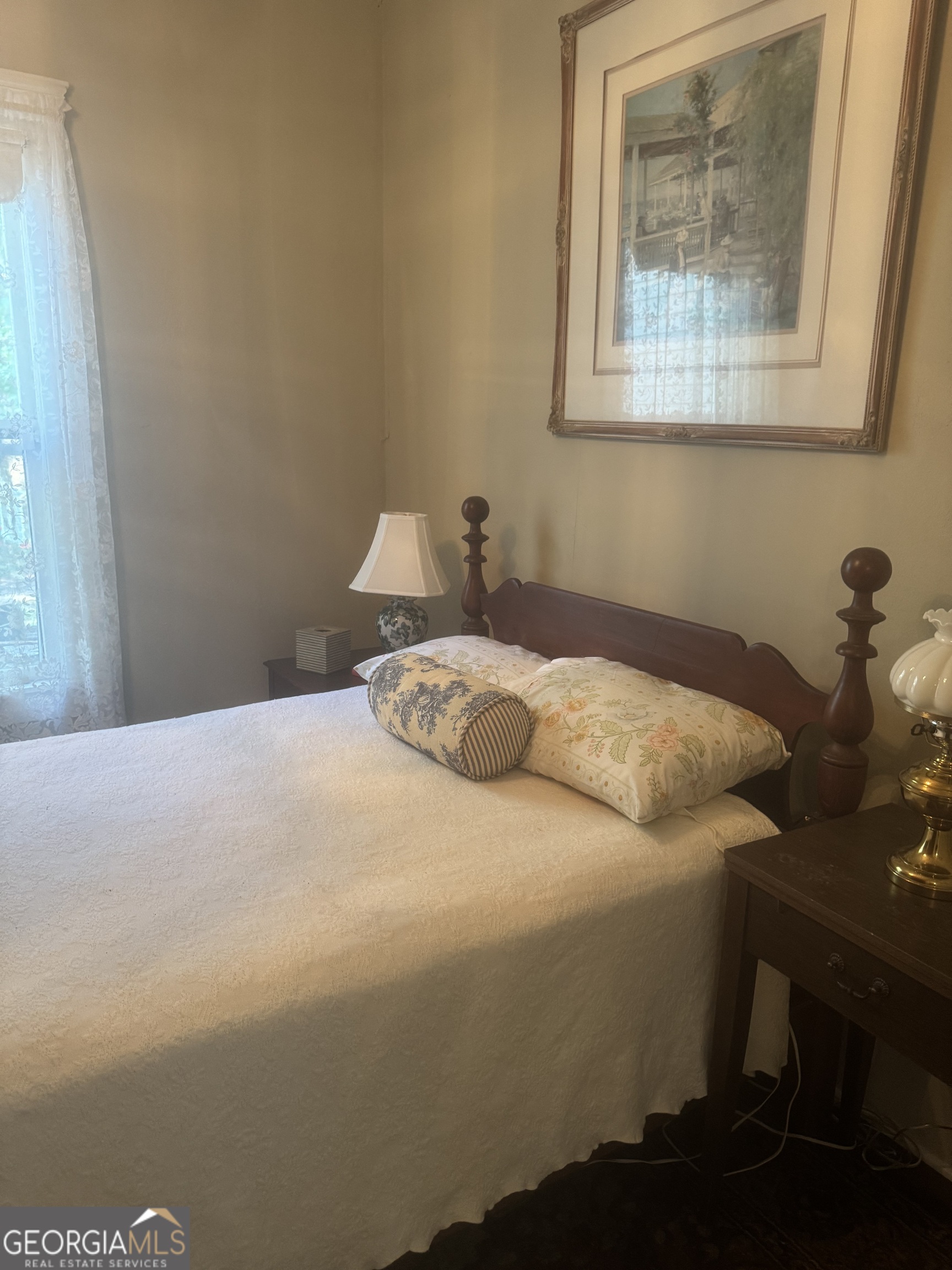 404 Ready Street St. Marys, GA 31558 - Photo 12 of 14 a bedroom with a bed and a wall painting