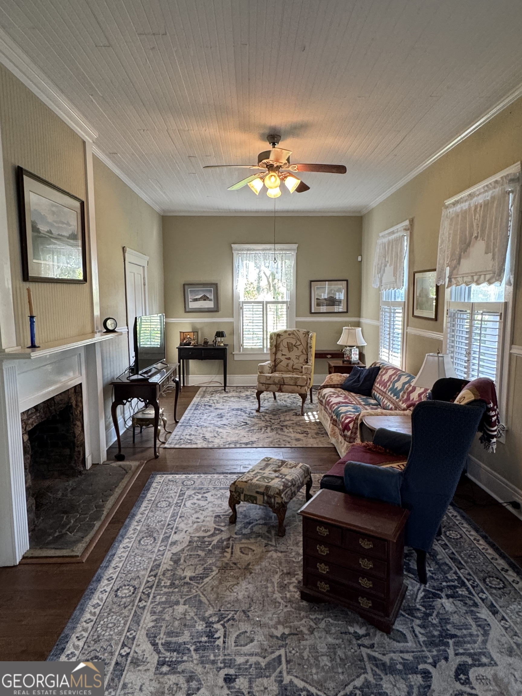 404 Ready Street St. Marys, GA 31558 - Photo 2 of 14 a living room with furniture a fireplace and a table
