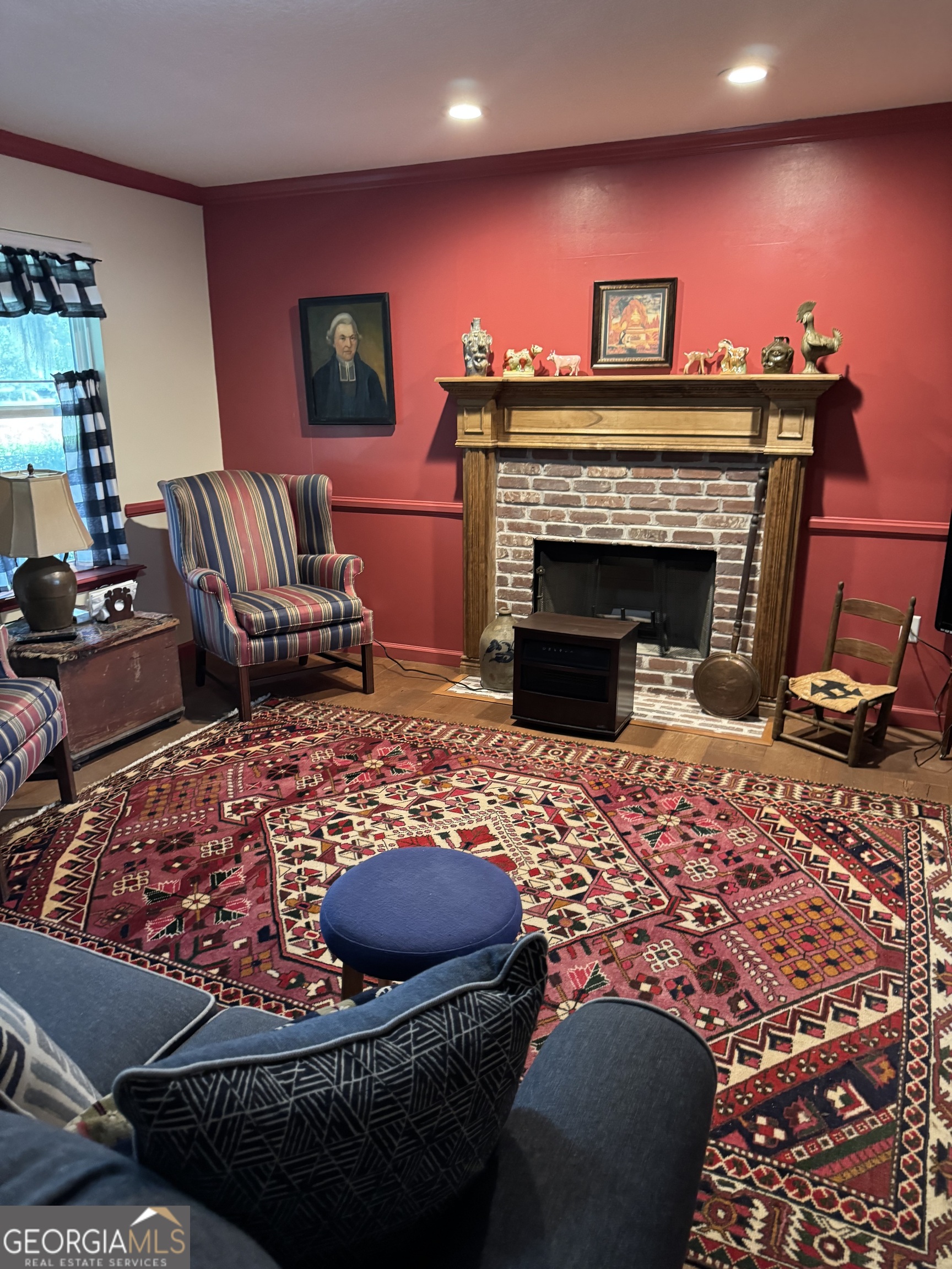 404 Ready Street St. Marys, GA 31558 - Photo 9 of 14 a living room with furniture a flat screen tv and a fireplace