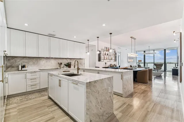 a kitchen with a sink stove and cabinets