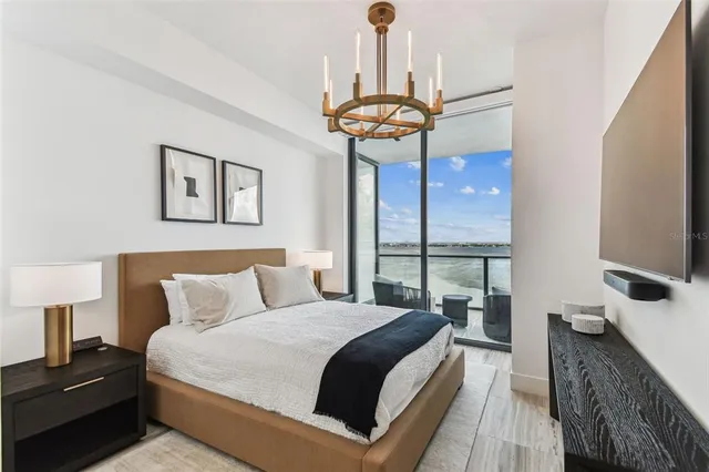 a bedroom with a bed and cabinets