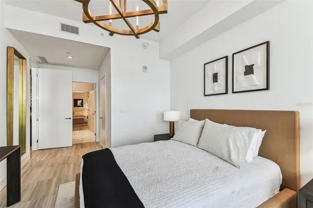 a bathroom with a granite countertop sink double and mirror