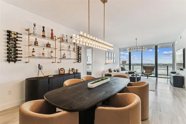 a kitchen with a table chairs stove and couches