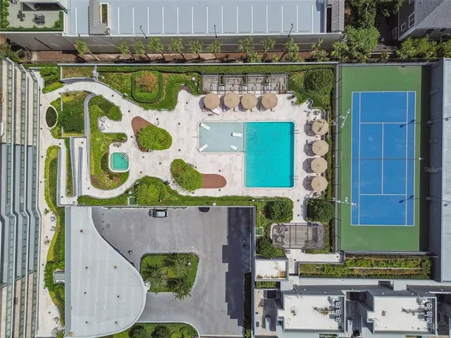 a view of a dining room with furniture windows and wooden floor