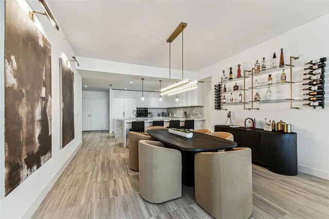 a kitchen with a sink stove and wooden floor