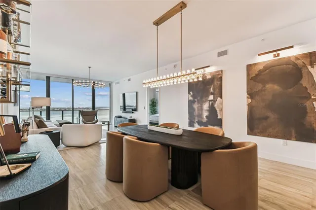 a dining room with furniture and wooden floor