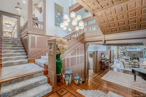 a view of staircase with white walls and a window