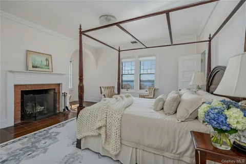 a dining room with furniture a chandelier and window